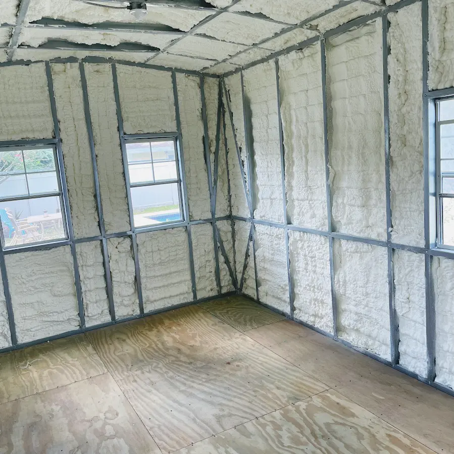 Closed-cell spray foam insulation applied to wall cavities in a residential project in Londonderry