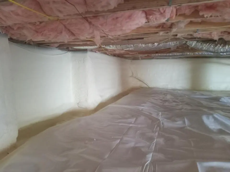 Crawl space encapsulation with closed-cell spray foam for Commercial Roof Restoration in Londonderry